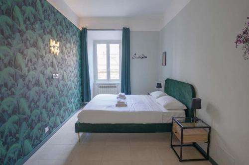 מיטה או מיטות בחדר ב-Crescenzio Stylish Apartment