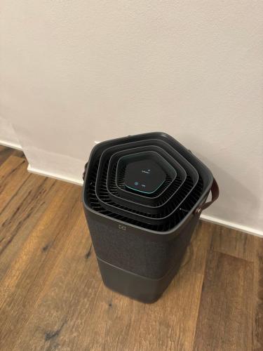 a black trash can sitting on a floor next to a wall at Luxury House in Bologna Marchesana 100 mq in Bologna