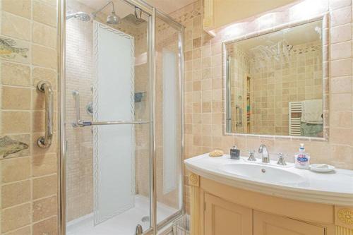 a bathroom with a shower and a sink and a shower at 17th Century Rural Home in Hawthorn