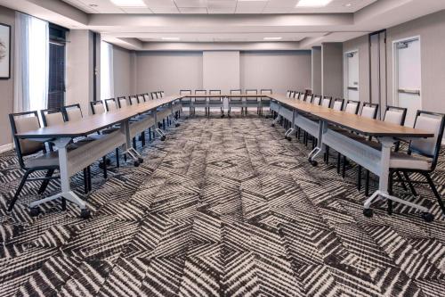 a conference room with a long table and chairs at Hyatt Place-Dallas/Arlington in Arlington