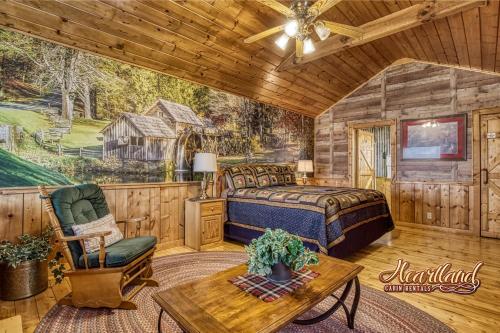 a bedroom in a cabin with a bed and a table at Top of the World 2 Bedroom 2 Bath Cabin between Pigeon Forge and Gatlinburg in Pigeon Forge