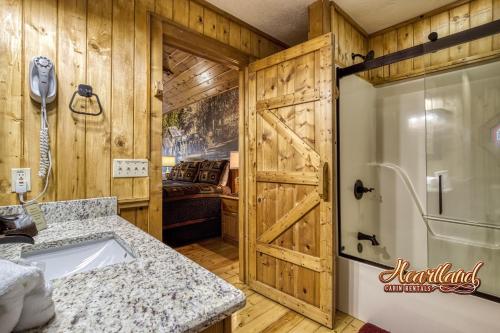 a bathroom with a shower and a sink at Top of the World 2 Bedroom 2 Bath Cabin between Pigeon Forge and Gatlinburg in Pigeon Forge