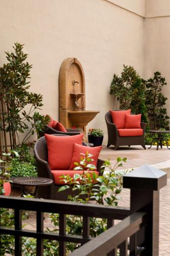 a patio with two chairs and a fountain at Hyatt Place Fredericksburg at Mary Washington in Fredericksburg