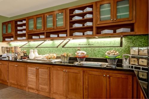 a kitchen with a counter with bowls of food at Hyatt Place Fort Lauderdale Cruise Port & Convention Center in Fort Lauderdale