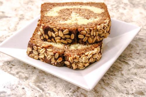 a slice of banana bread on a white plate at Hyatt Place Chantilly Dulles Airport South in Chantilly