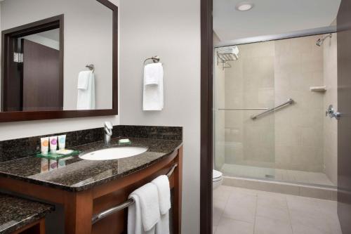a bathroom with a sink and a shower at Hyatt Place Sugar Land in Sugar Land
