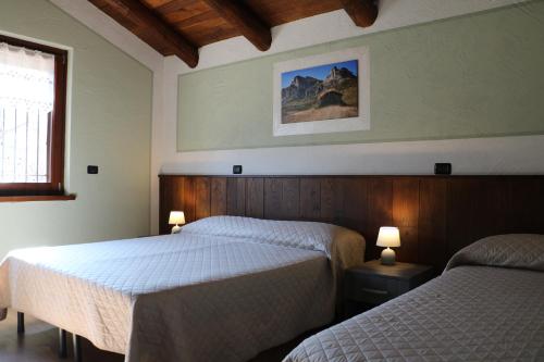 A bed or beds in a room at Casa Vacanze Le Primule