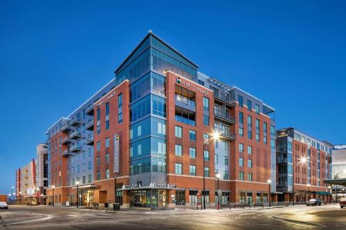 a large brick building on a city street at Hyatt Place Lincoln/Downtown-Haymarket in Lincoln