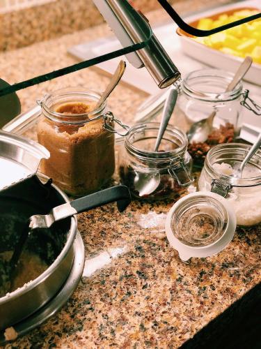 a counter top with some food and jars on it at Hyatt Place Kansas City/Overland Park/Convention Center in Overland Park
