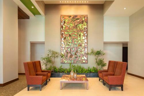a waiting room with two chairs and a table at Hyatt Place Manati in Manati