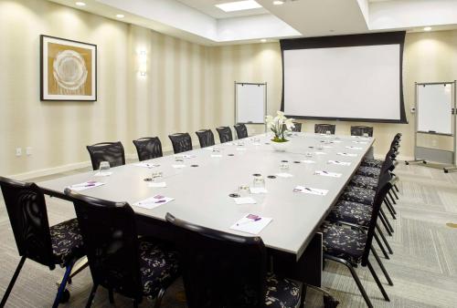a large conference room with a large table and chairs at Hyatt Place Miami Airport East in Miami