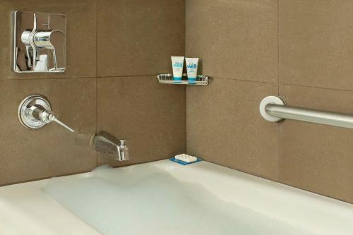 a bathroom with a sink and a faucet at Hyatt House Dallas / Frisco in Frisco