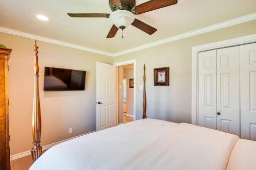 a bedroom with a bed and a ceiling fan at HOT TUB - Beautifully Renovated Home in West Texas in Fort Stockton