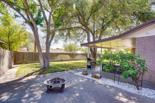 a backyard with a fire pit and a tree at HOT TUB - Beautifully Renovated Home in West Texas in Fort Stockton