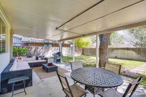 a patio with a table and chairs and a grill at HOT TUB - Beautifully Renovated Home in West Texas in Fort Stockton