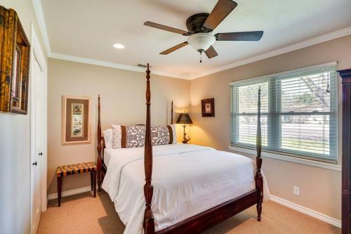 a bedroom with a bed with a ceiling fan at HOT TUB - Beautifully Renovated Home in West Texas in Fort Stockton