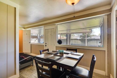 a dining room with a table and a window at HOT TUB - Beautifully Renovated Home in West Texas in Fort Stockton