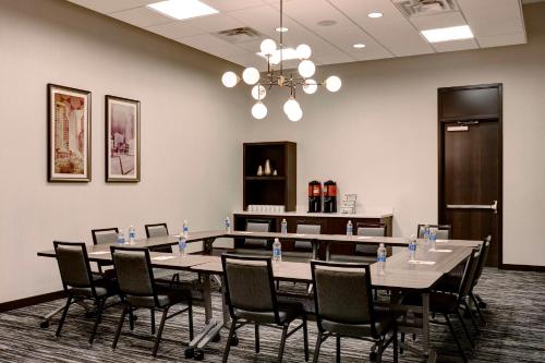 a conference room with a long table and chairs at Hyatt Place St. Paul in Saint Paul