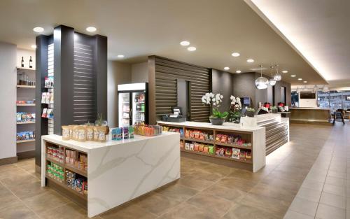 a grocery store aisle with a counter in a store at Hyatt House Portland / Downtown in Portland