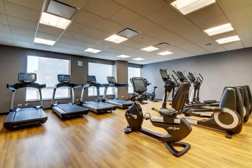 a gym with treadmills and elliptical machines at Hyatt House Chicago/Evanston in Evanston