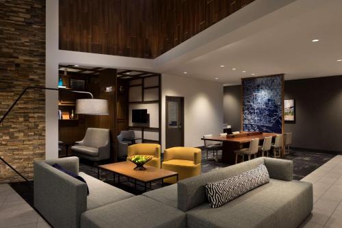 a living room with a couch and a table at Hyatt Place Biloxi in Biloxi