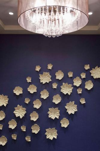 a bunch of cookies on a table under a chandelier at Hyatt House Charleston - Historic District in Charleston