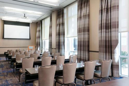 a conference room with rows of tables and chairs at Hyatt House Charleston - Historic District in Charleston