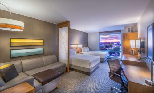 a hotel room with a bed and a couch at Hyatt Place Washington D.C./National Mall in Washington
