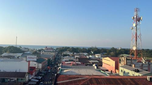 an aerial view of a city with a radio tower at Los Guacamayos La Ceiba in La Ceiba