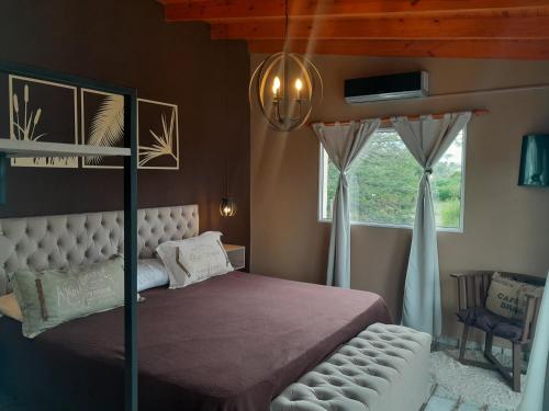 En eller flere senge i et værelse på Departamento:La Aldea