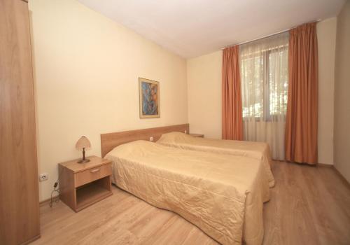 A bed or beds in a room at Hotel Gloria Palace Diplomat