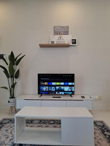 Televisyen dan/atau pusat hiburan di DAHLYA HOMESTAY
