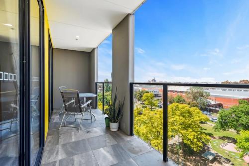 a balcony with a view of the ocean at Executive and Spacious Apartment with Balcony in Sunshine