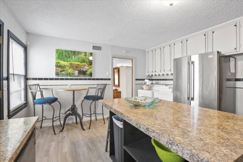 a kitchen with a counter top and a refrigerator at Luxury Oasis- 1 bedroom romantic getaways in Lubbock