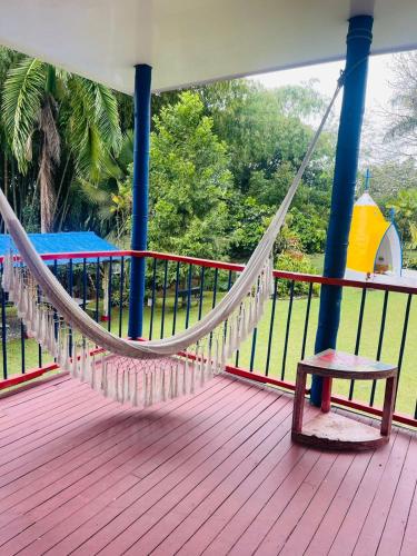a hammock on the deck of a boat at Finca Hotel el Edén del Quindío in Calarcá