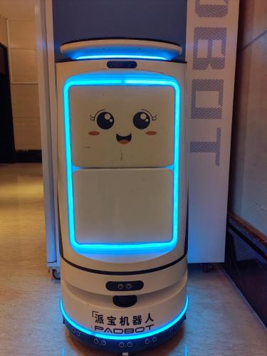 a close up of a phone with a face on it at Guangzhou Baiyun Airport Yunzhi Hotel near Terminal One - Complimentary Shuttle Bus between hotel to Canton Fair Complex during Canton Fair in Guangzhou