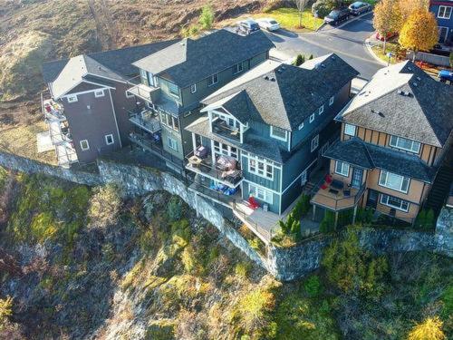 an aerial view of a large house on a hill at Guest room with private bath in Langford in Victoria