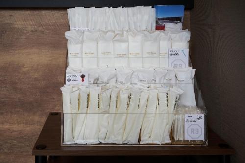 a display of white toilet paper on a table at HOTEL R9 The Yard Asahishiro in Asahi