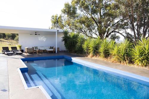 a swimming pool in the backyard of a house at The Albens - Countryside Chic amongst the Hills in Mudgee