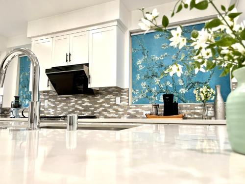 a kitchen with a sink and a counter top at Casa Dolce Vita - Luxury Modern Stays - Flexible Monthly Arrangements Available 30-Night Minimum in Irvine