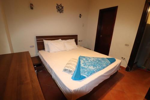 Porto Sokhna Hotel tesisinde bir odada yatak veya yataklar