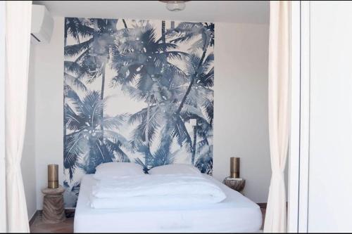 Una cama o camas en una habitación de Villa Indigo