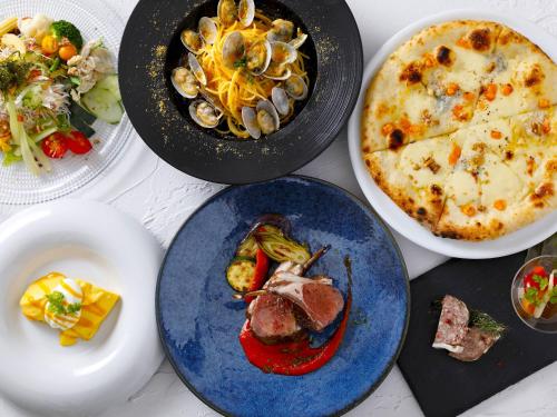 a group of plates of food on a table at Hotel Shigira Mirage Beach Front in Miyako Island