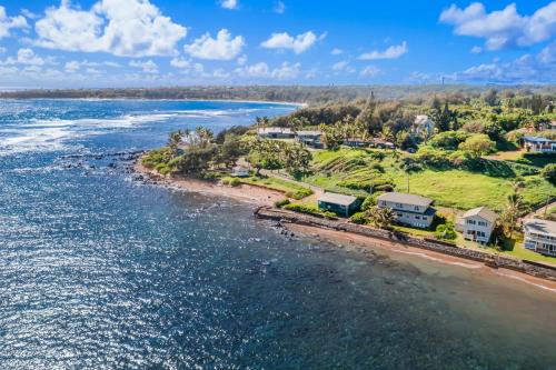 an aerial view of a beach with houses at Kauai Aliomanu home in Anahola