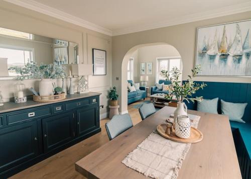 a living room with a table and a couch at Rockfield in Kinvara