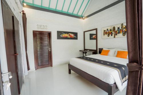 Una cama o camas en una habitación de Astana Swaha Villa