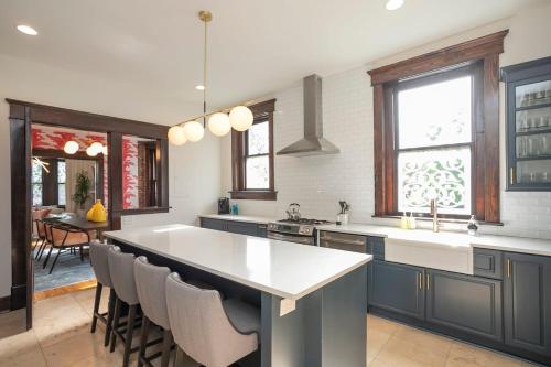 a kitchen with a large island with a counter top at Historic Jewel in Hillsboro Village in Nashville