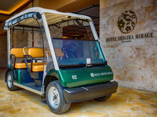 a golf cart is parked in a lobby at Hotel Shigira Mirage Beach Front in Miyako Island