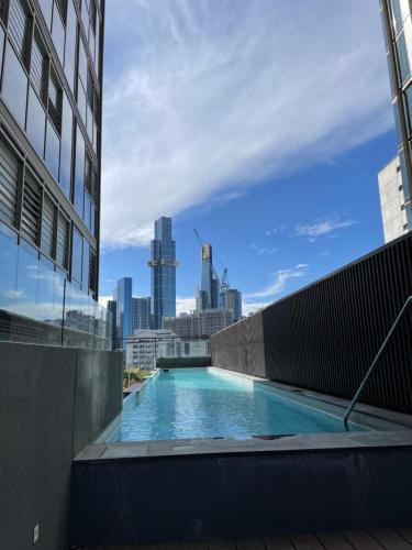 a swimming pool on the roof of a building at Perfect City View and gorgeous apartment in Melbourne