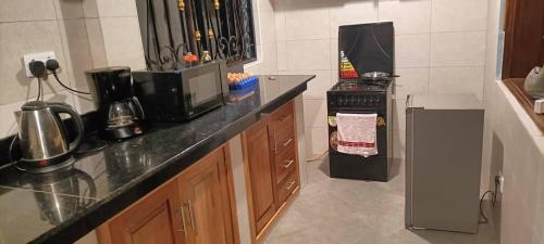Kuchyň nebo kuchyňský kout v ubytování Cosy Living